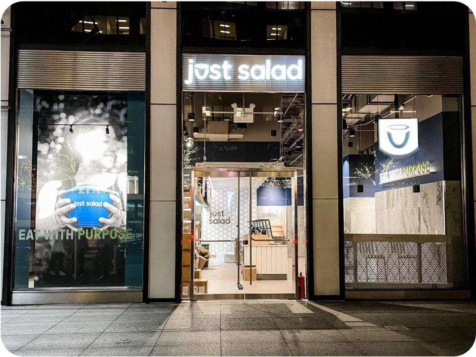 Just Salad illuminated storefront and window graphics